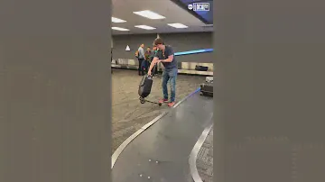 Man rides scooter luggage. #travel #airport #adventure